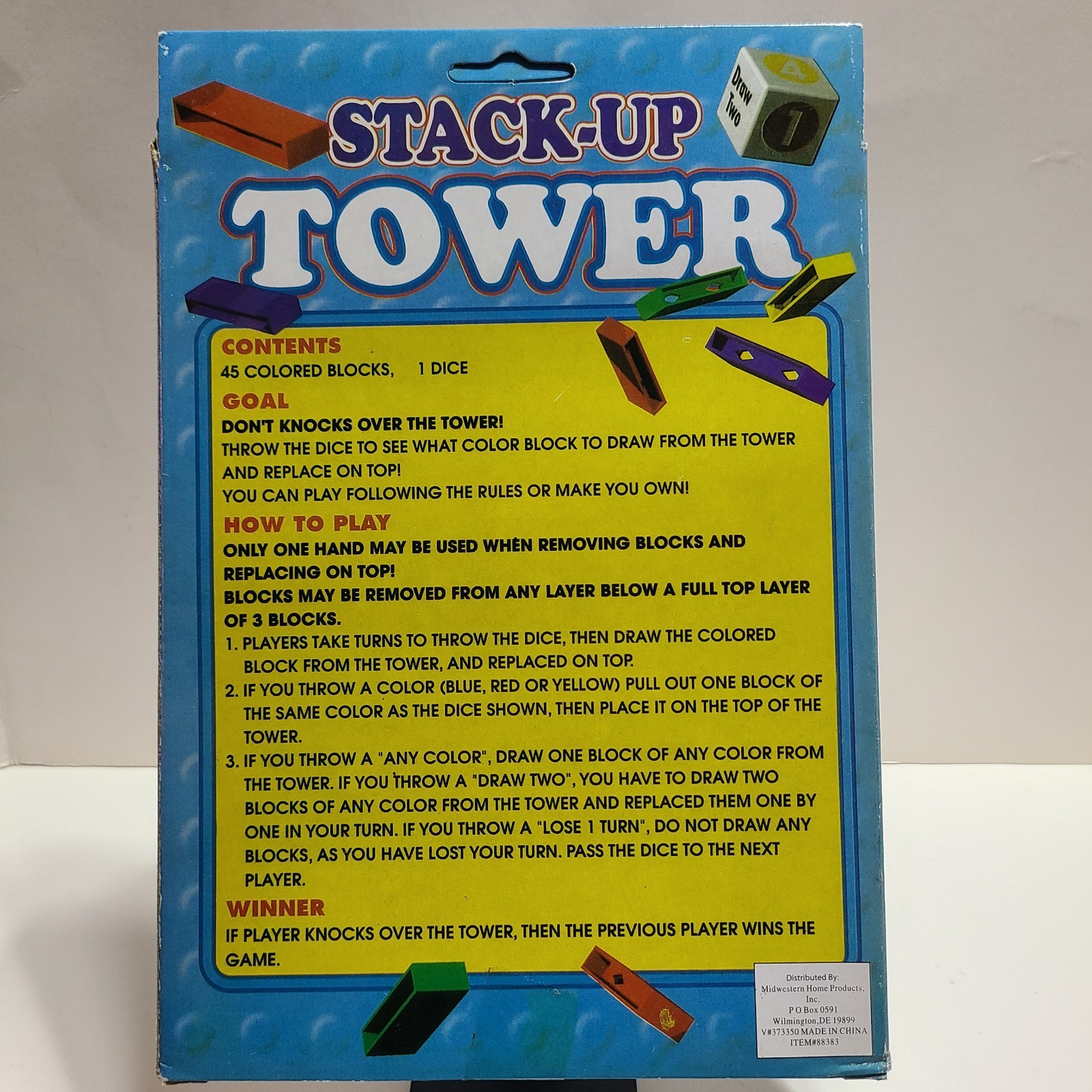Stack Up Tower with 45 Colored Plastic Blocks and One Dice.