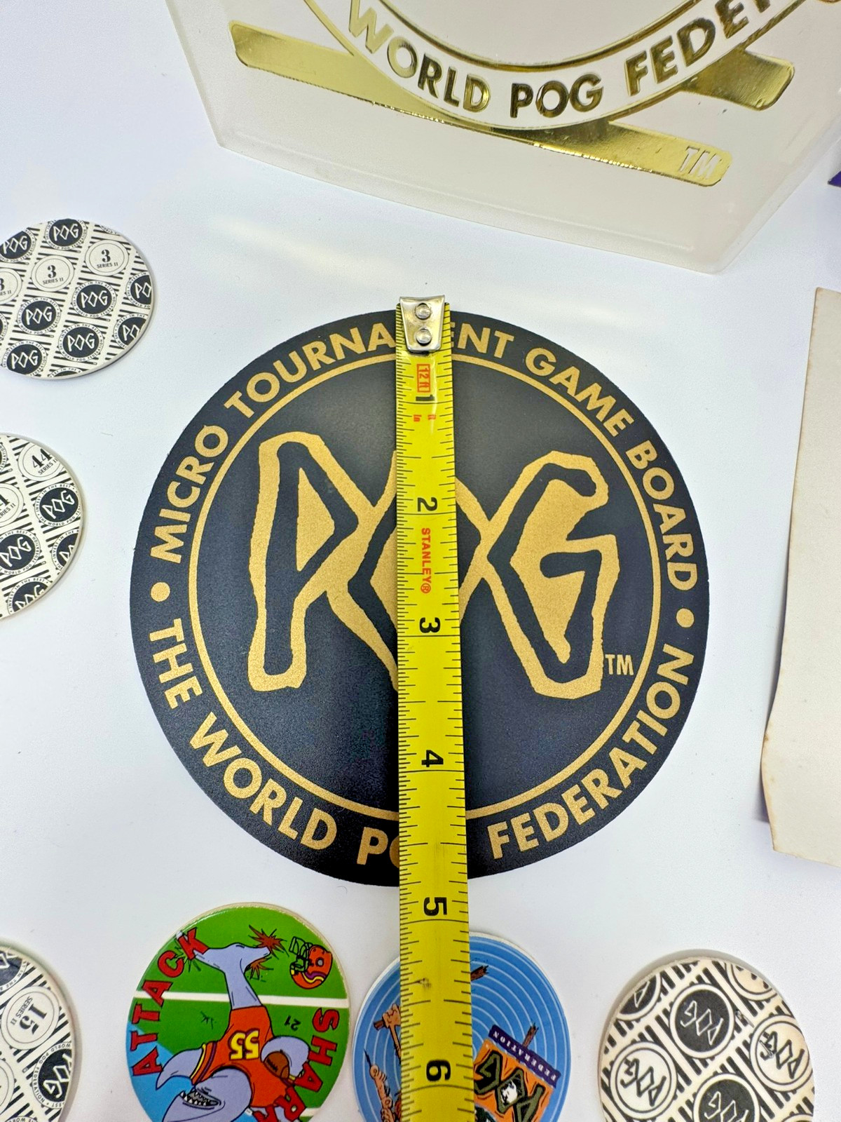 The World POG Federation Micro Tournament Game Pack with 2 Slammers & 25 Pogs