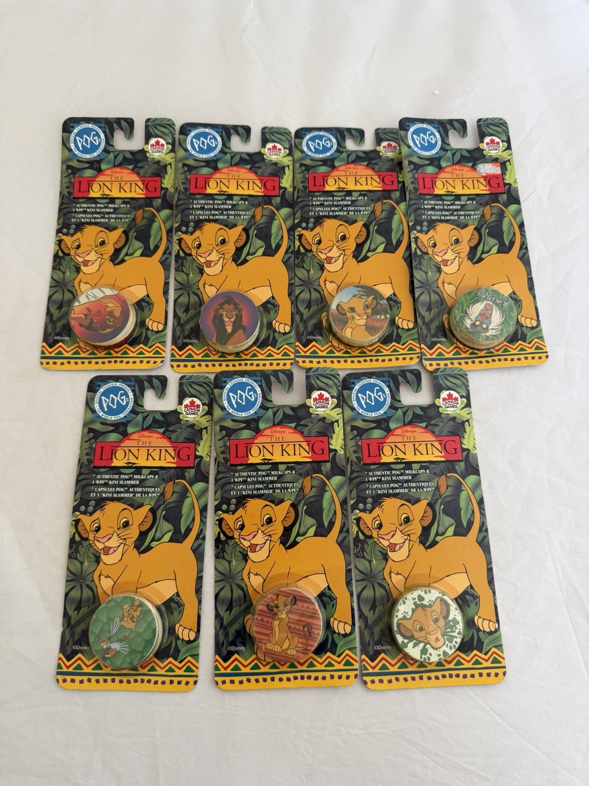 The World Pog Federation Lot of 7 The Lion King Carded Pogs with Slammer New