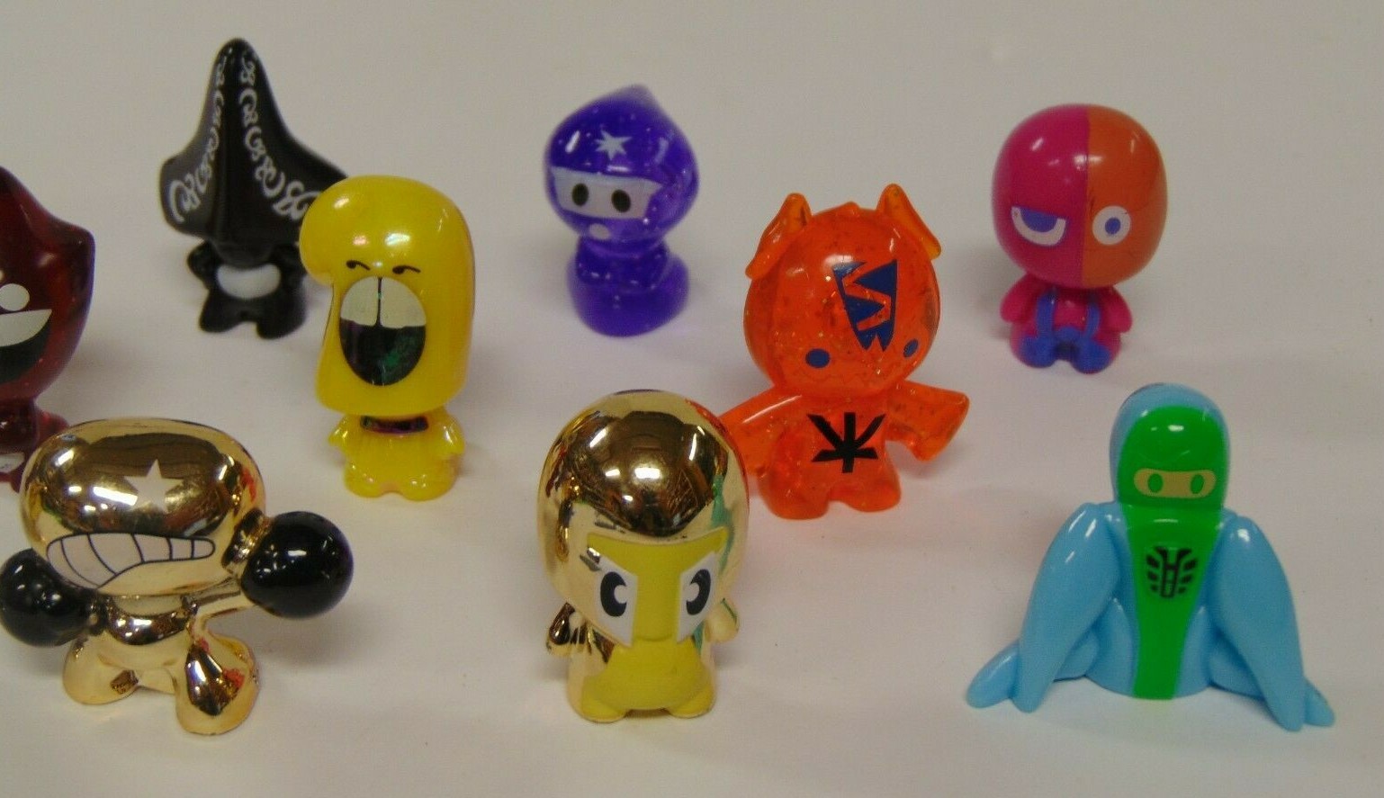 Gogo’s Crazy Bones Lot of 12 with gold bone and Green Cloth Bag pouch