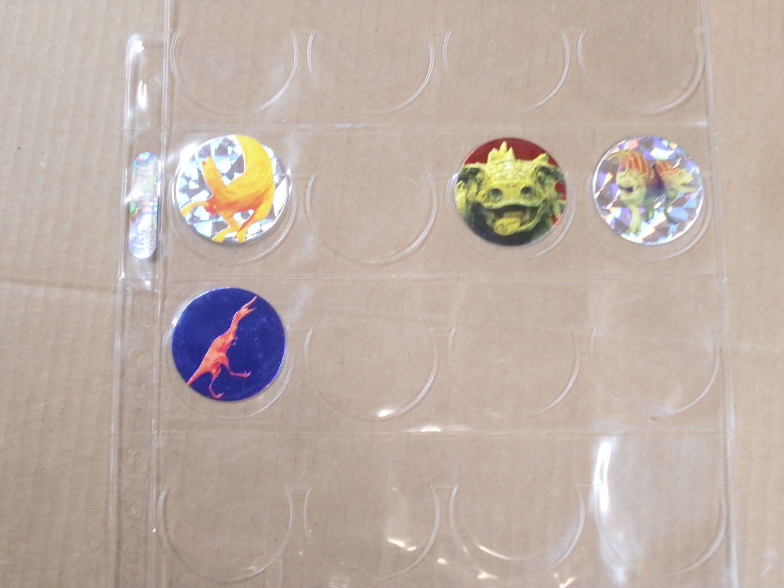 POGS/MILKCAPS DISNEY’S “DINOSAUR” BY MAGIC BOX INT. HAVE 88 OF 105 NEEDED