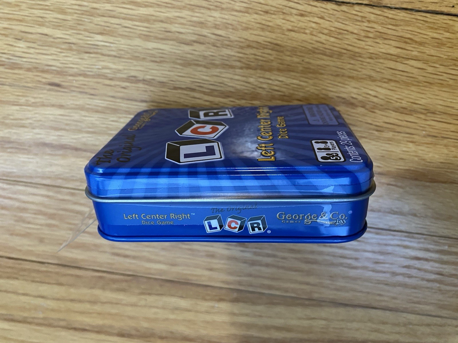 Brand New! LCR® Left Center Right™ Dice Game – Blue Tin Packaging