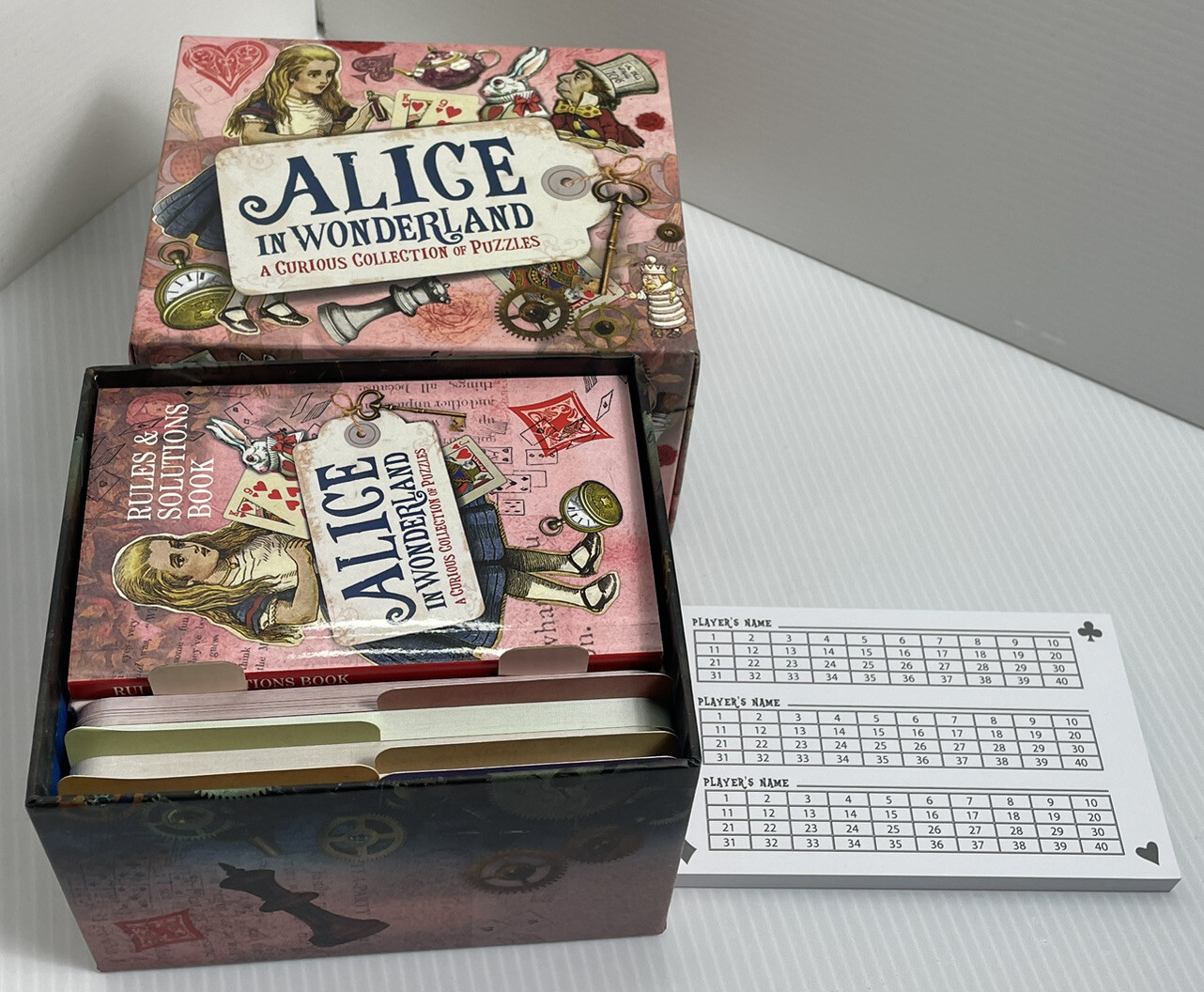 Sterling Innovation Alice in Wonderland Collection of Puzzles Trivia Game Open