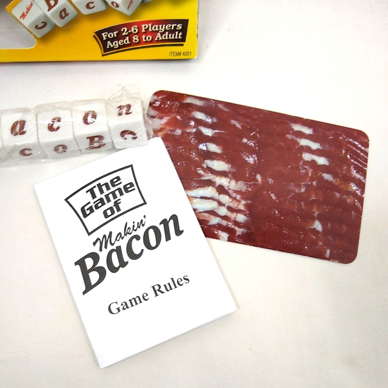 Makin’ Bacon Dice Game 2-6 Players Age 8+ Open box with some flaws