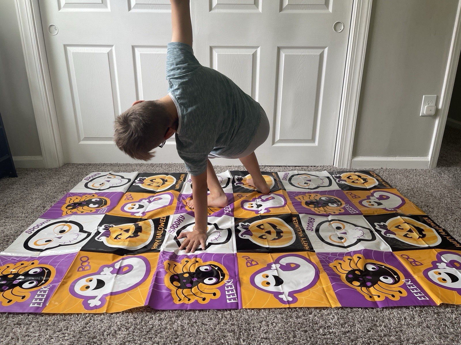 Halloween Bend and Twist Party Game, 48×72 inch Floor Mat + Spinner Dial