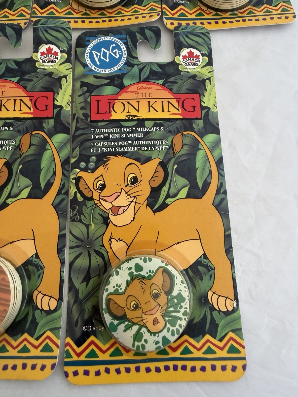 The World Pog Federation Lot of 7 The Lion King Carded Pogs with Slammer New