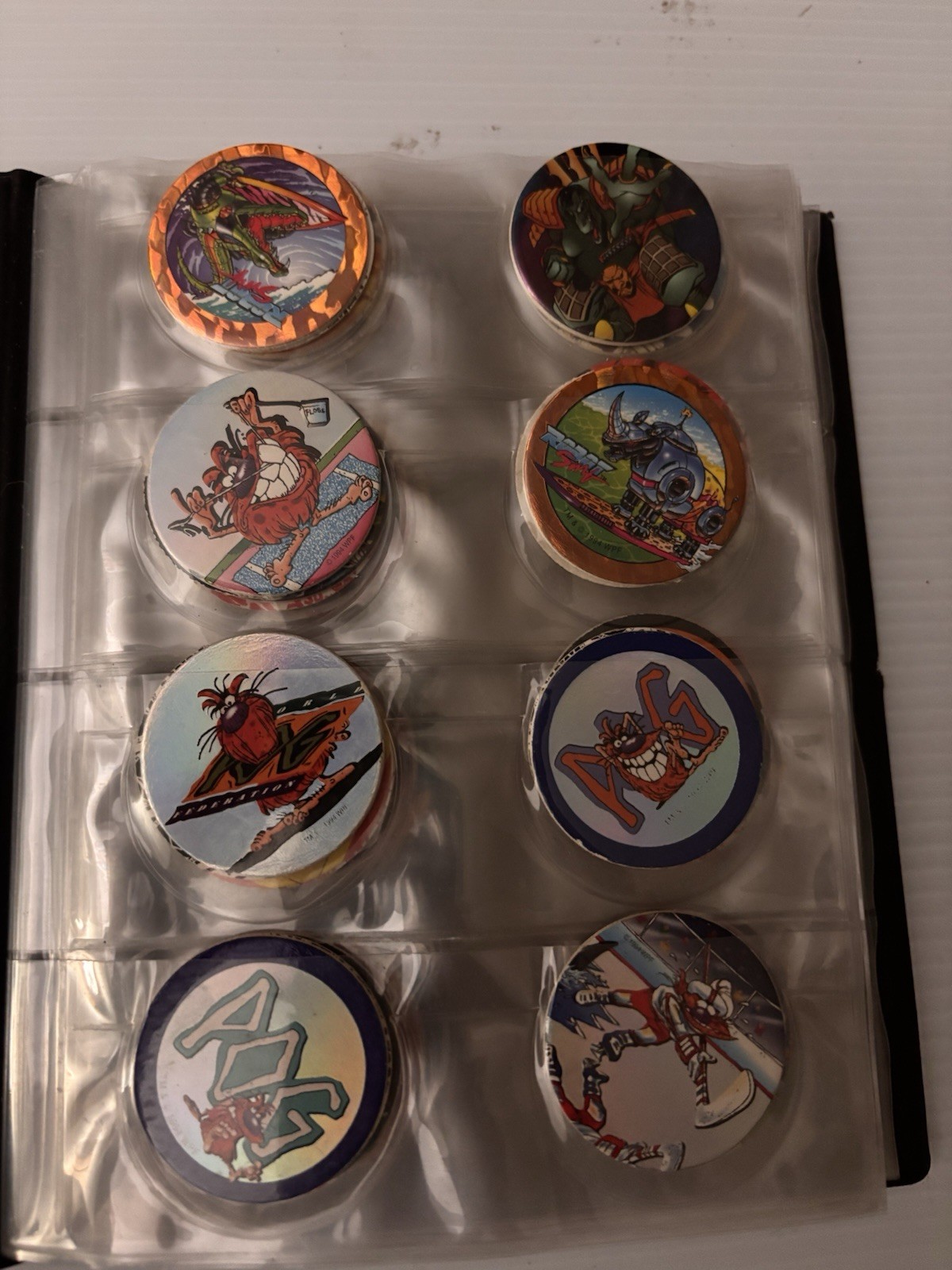 8 Page Pog Cap Album With 118 Pogs