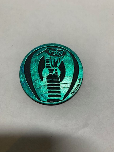 Metallic Green colored vintage pog from The World Pog Federation 1995