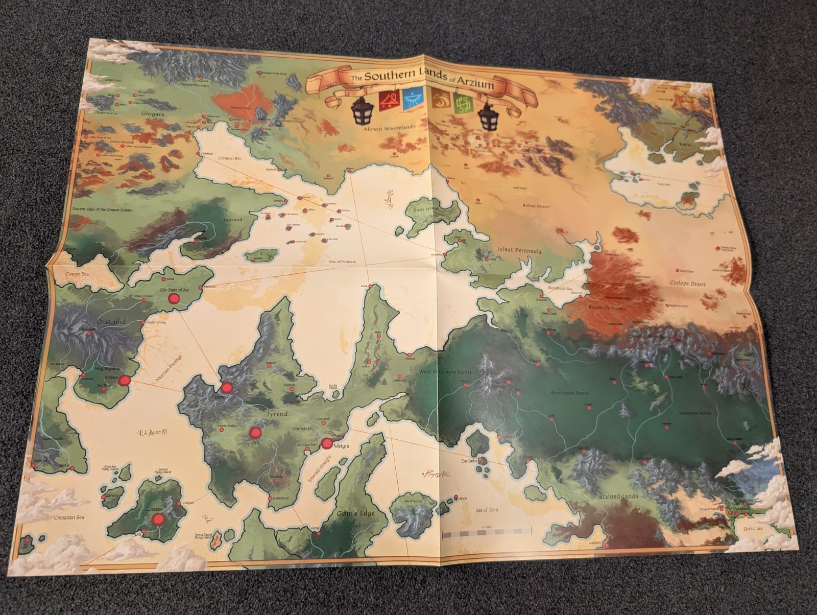 The Southern Lands of Arzium 22×16 Poster, Creature Caravan Deluxe: Red Raven