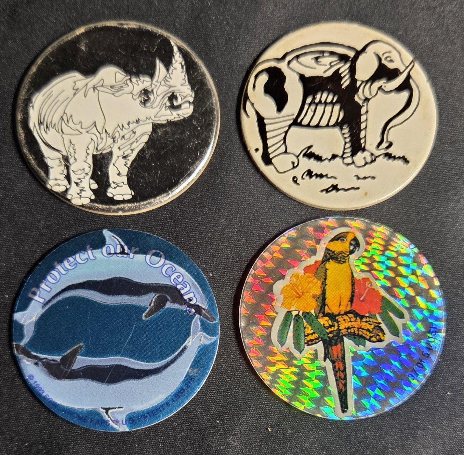 Set Of 4 Vintage 90s Pogs Rhino Dolphins Parrot Elephant
