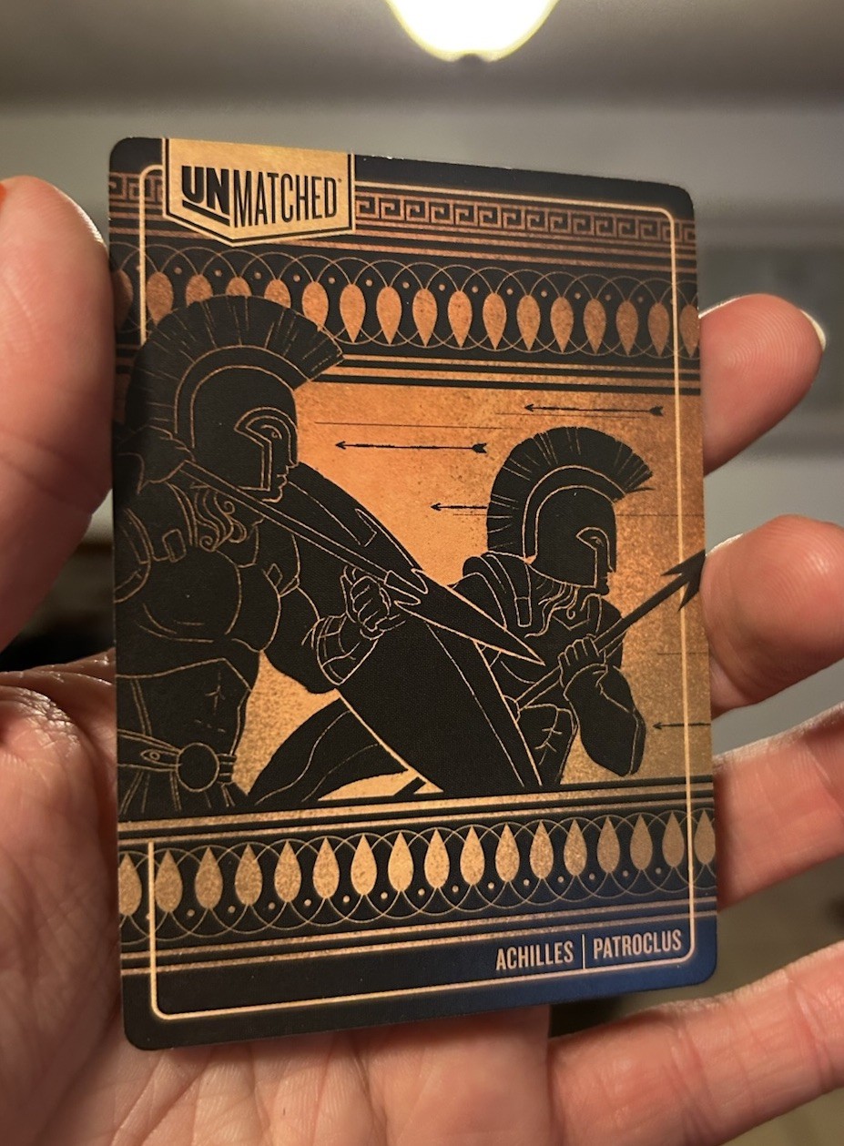 Unmatched Foil Promo Card – Achilles Heel – Restoration Games – Brand new
