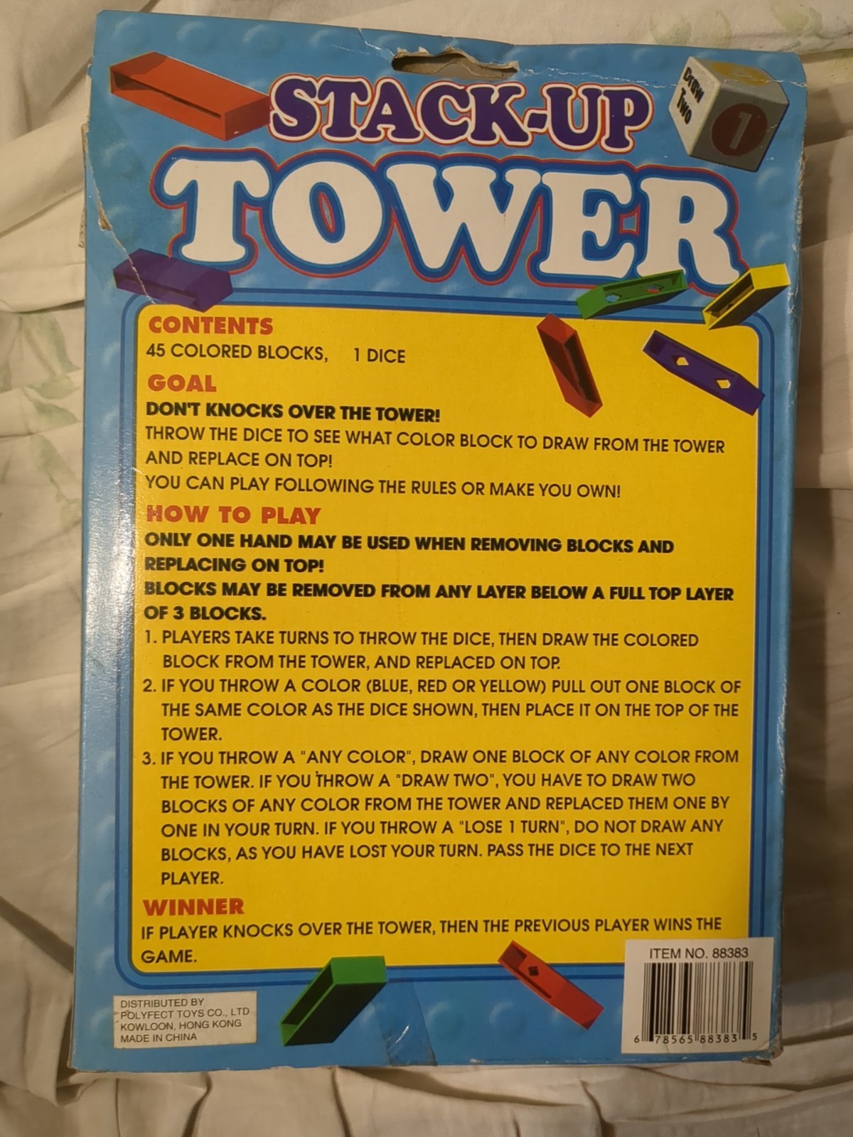 Stack Up Tower with 45 Colored Plastic Blocks and One Dice.
