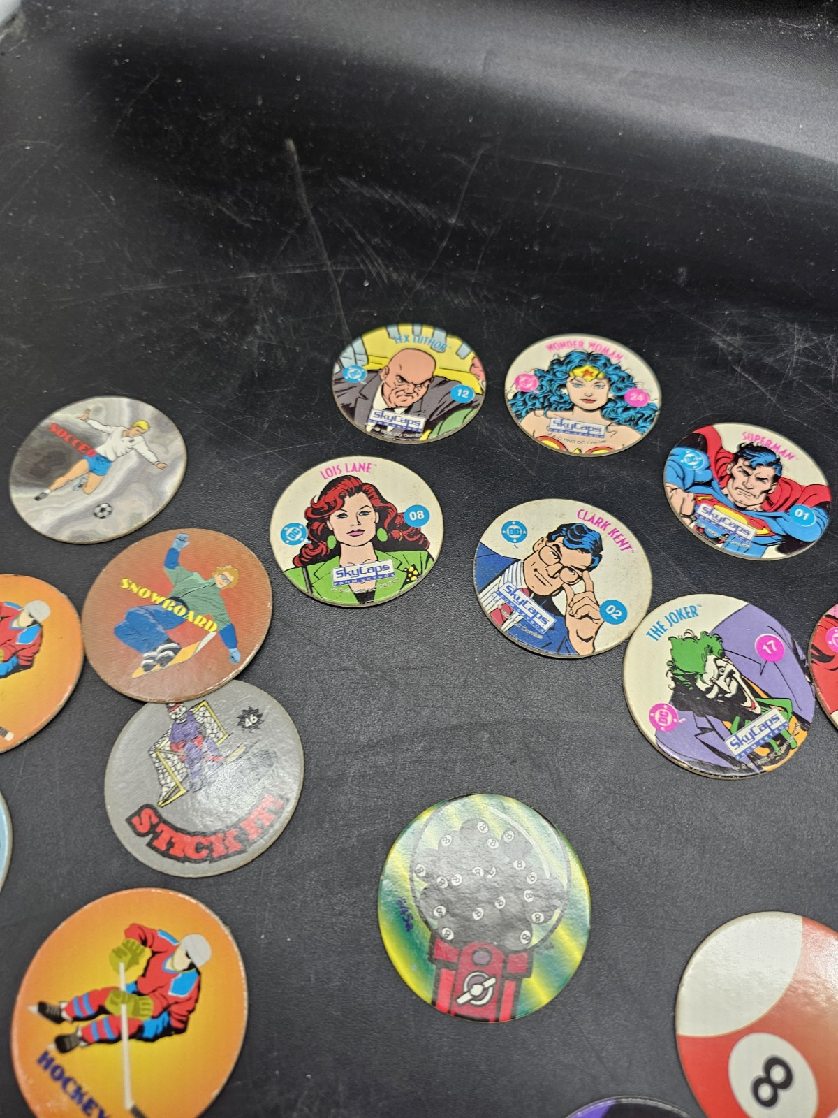 POGS Lot DC comics Sports 8 Ball Disney Poison Red Wings Slammer