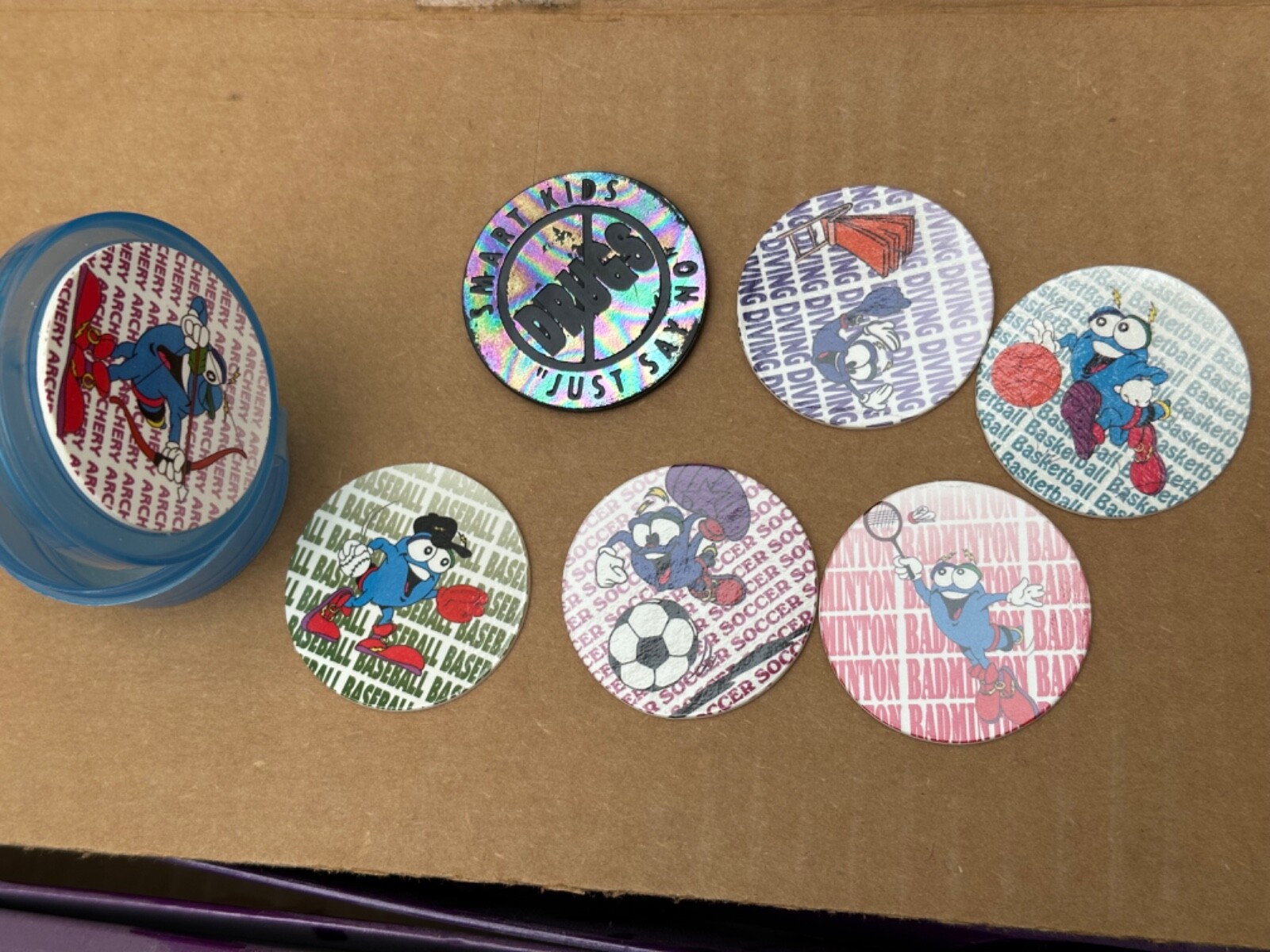 Olympics Pogs Vintage 1996 with Kini Slammers Izzy Atlanta, One Random Container