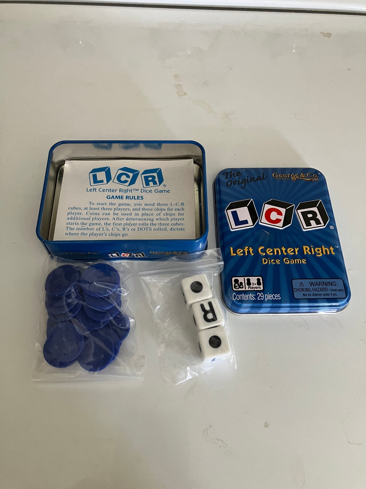 LCR® Left Center Right™ Dice Game – Blue Tin