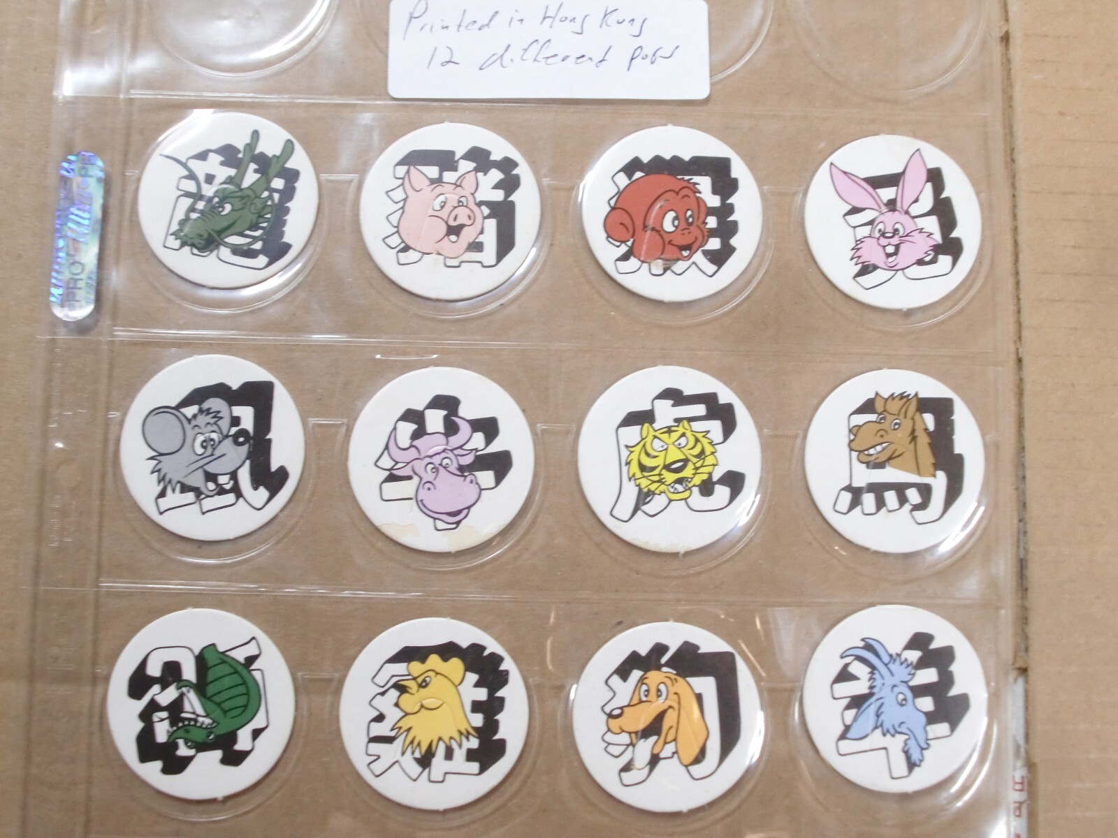 POGS/MILKCAPS ANIMALS PRINTED IN HONG KONG (12) DIFFERENT & SHEETED