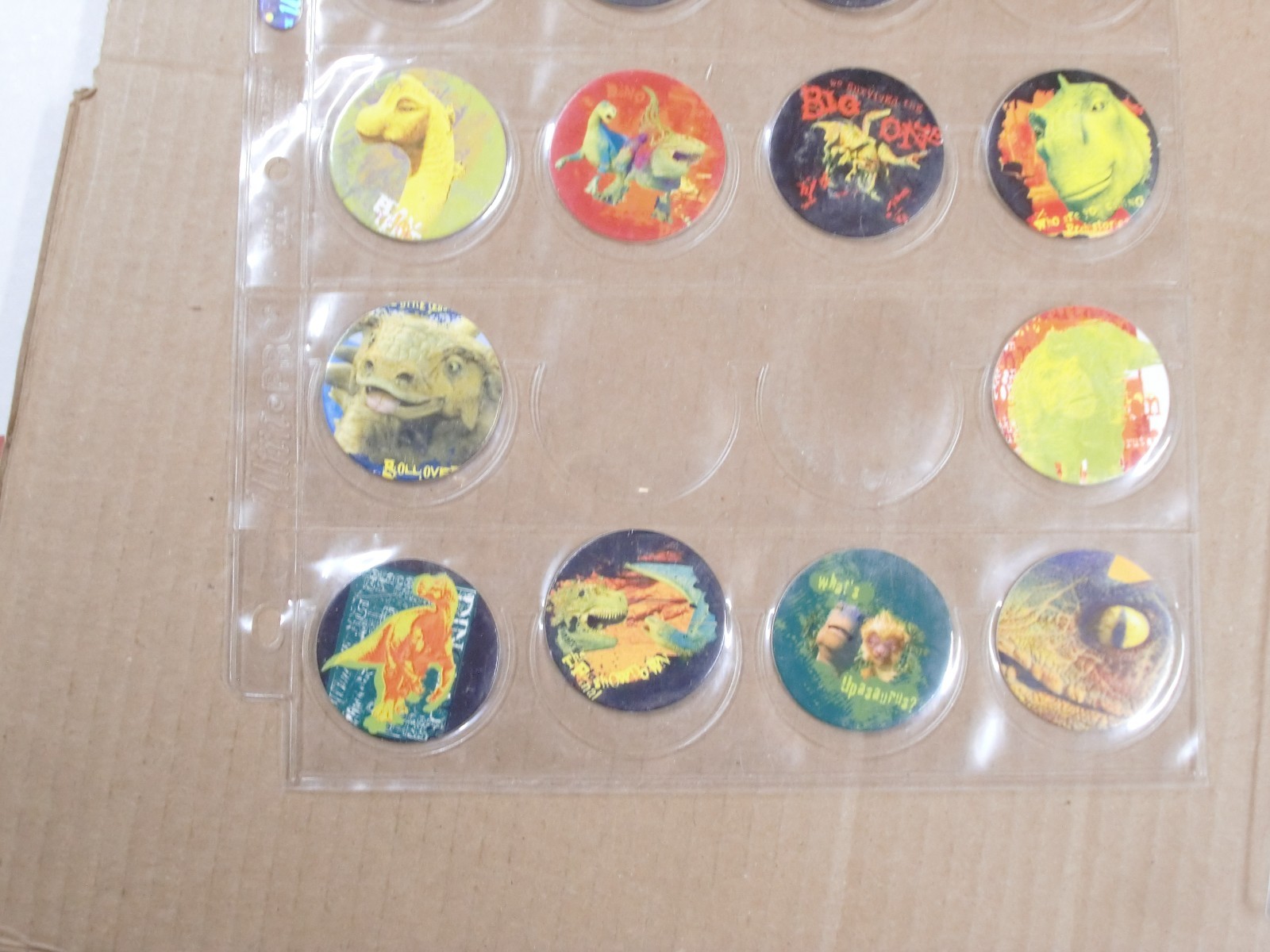 POGS/MILKCAPS DISNEY’S “DINOSAUR” BY MAGIC BOX INT. HAVE 88 OF 105 NEEDED