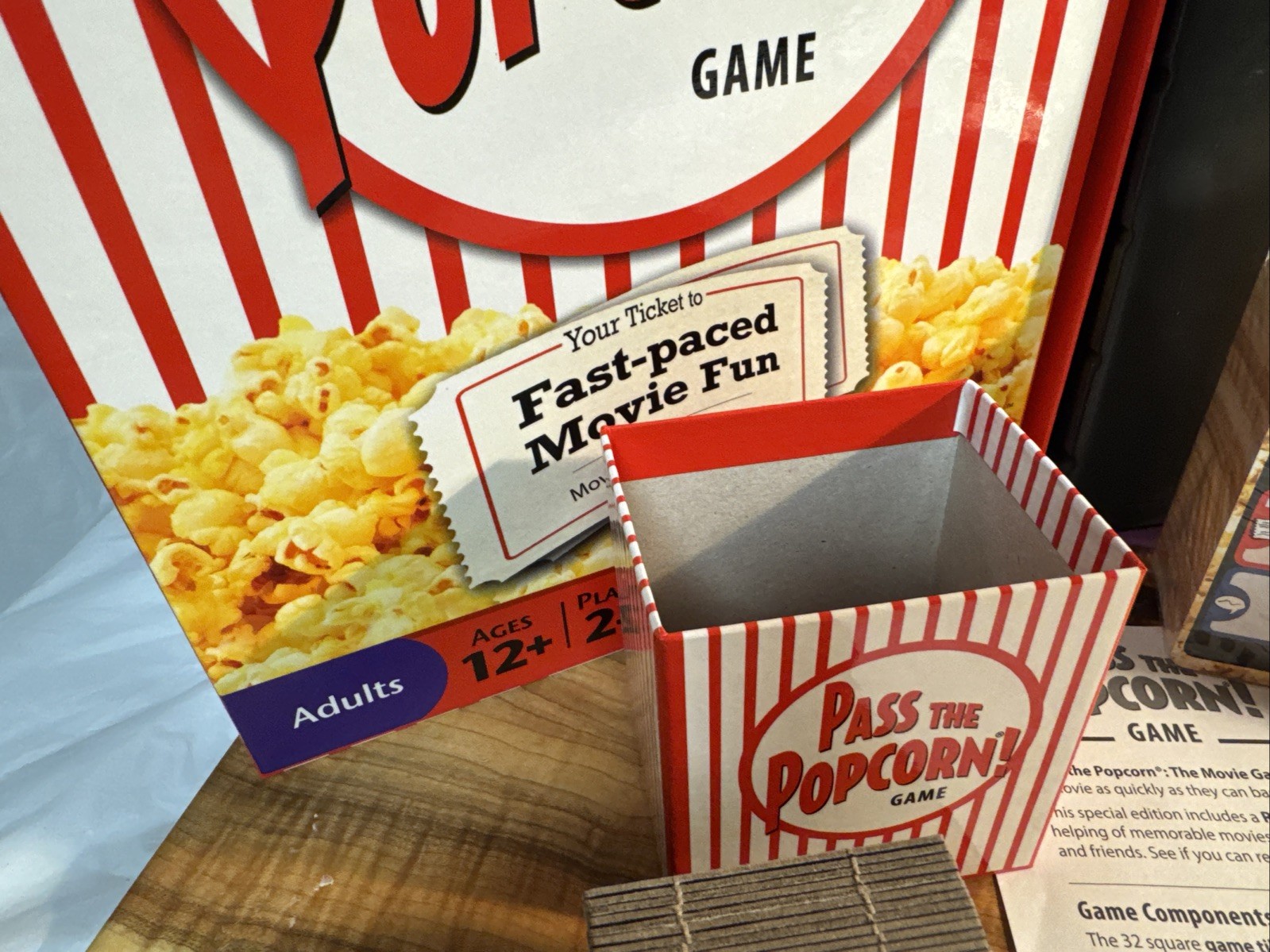 Pass the Popcorn Trivia game. New and complete . Open box.