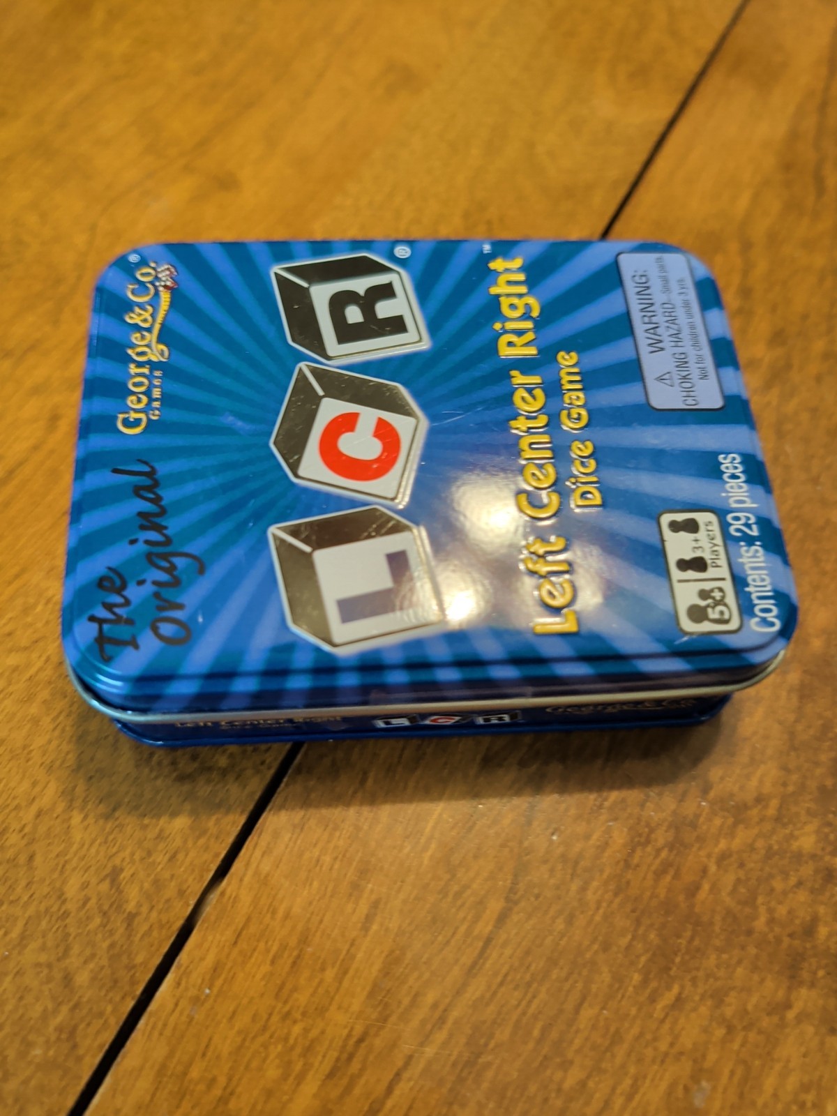 LCR® Left Center Right™ Dice Game – Blue Tin