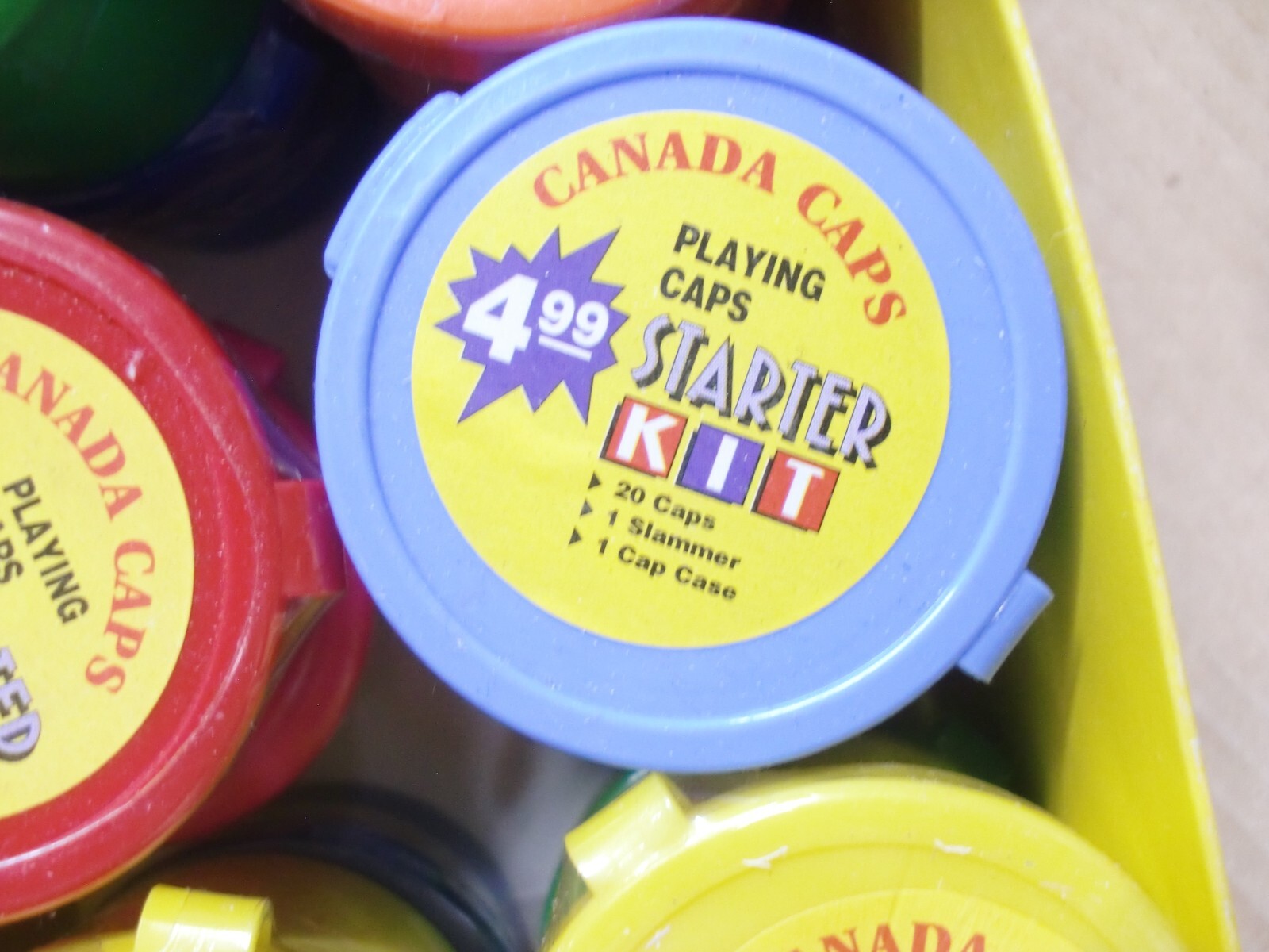 POGS/MILKCAPS CANADA CAPS STARTER KITS BOX WITH 16 STARTER POG KITS IN CANISTERS