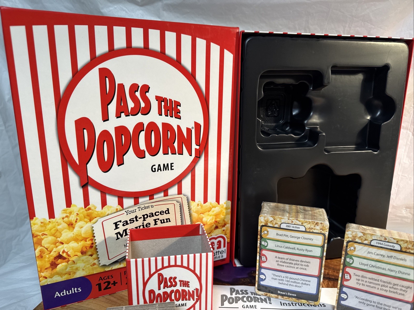 Pass the Popcorn Trivia game. New and complete . Open box.