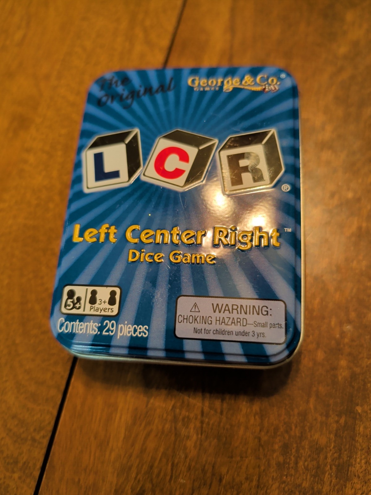 LCR® Left Center Right™ Dice Game – Blue Tin