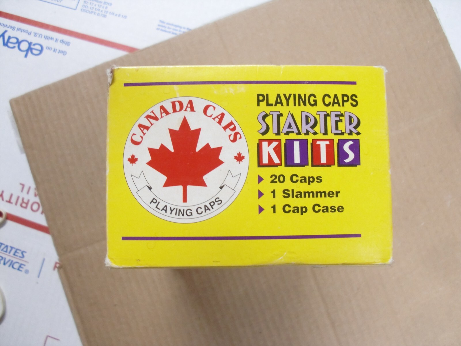 POGS/MILKCAPS CANADA CAPS STARTER KITS BOX WITH 16 STARTER POG KITS IN CANISTERS