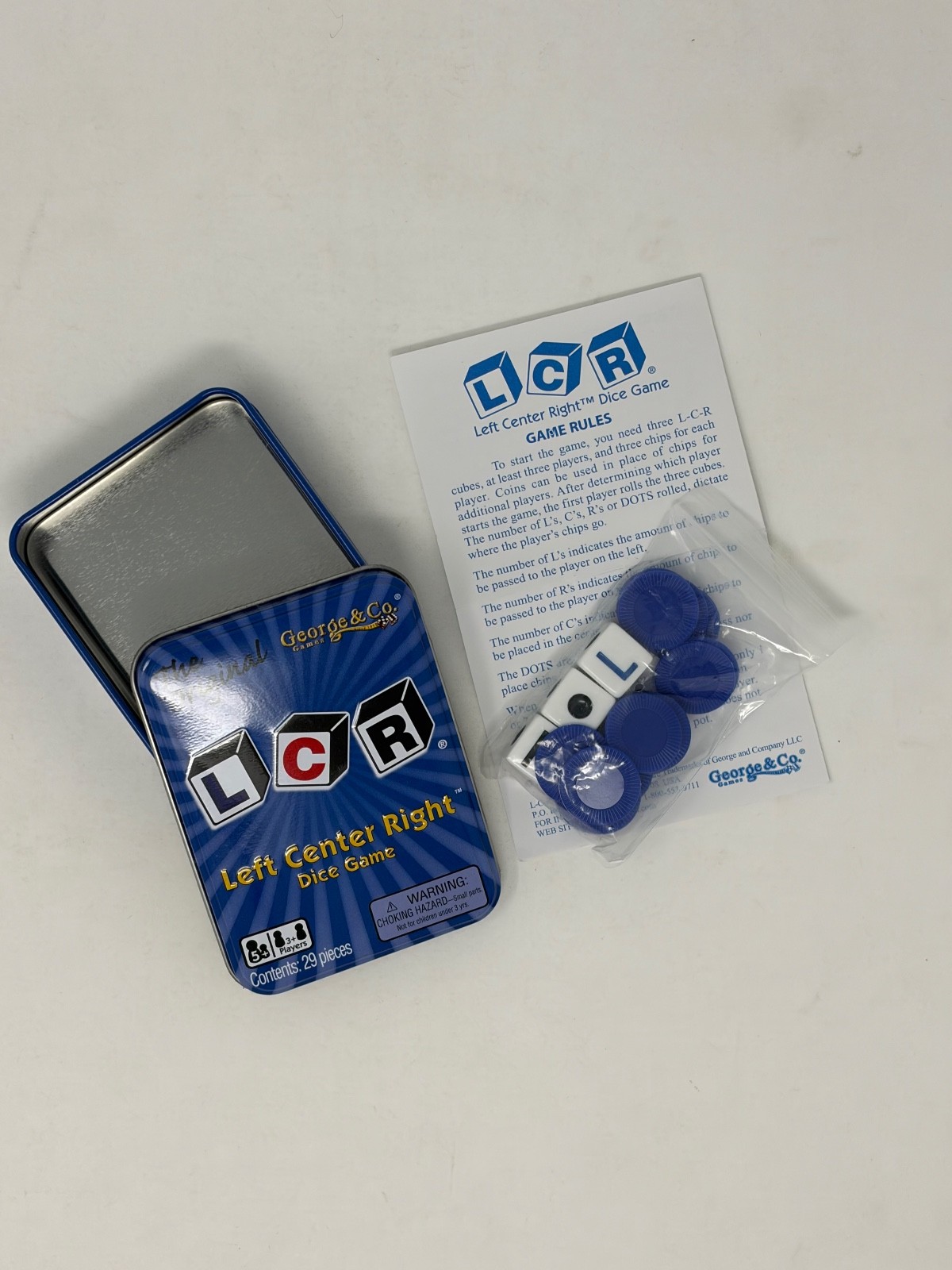 The Original LCR Left Center Right Dice Game Blue Tin
