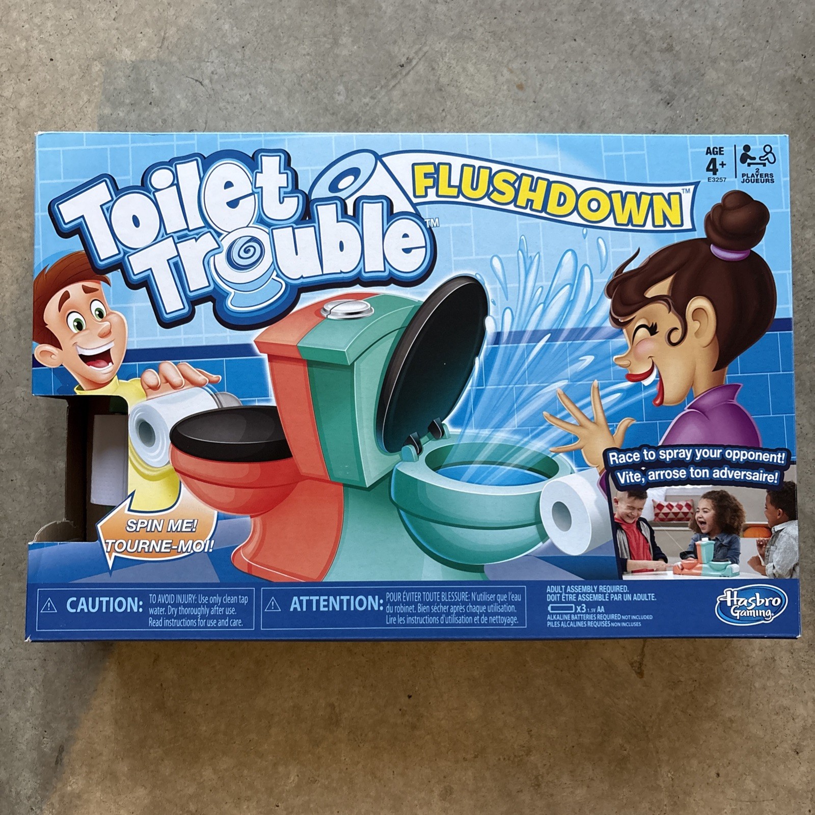 Hasbro Gaming Toilet Trouble Flushdown Kids Game Water Spray Ages 4+ ES. V