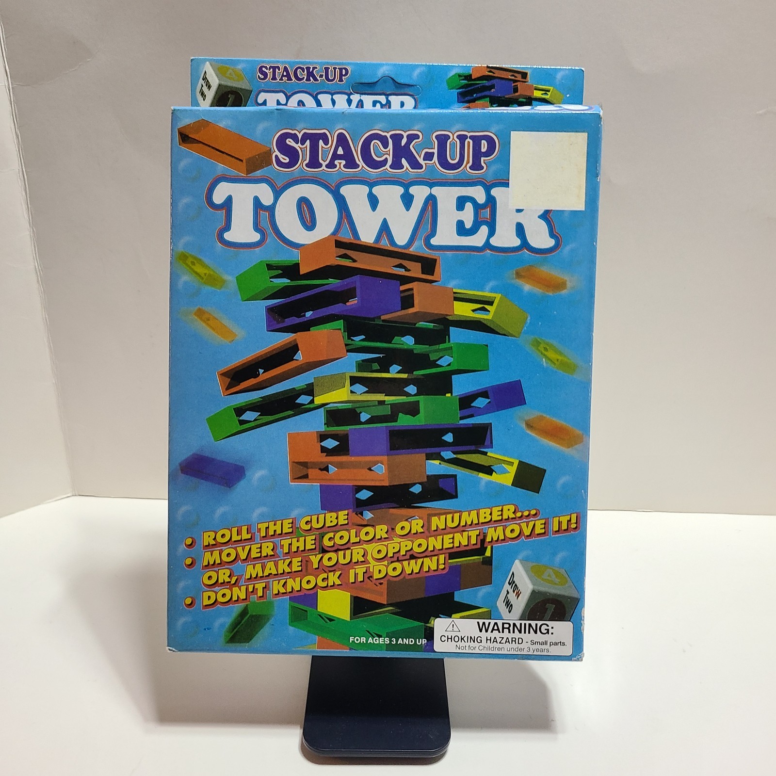 Stack Up Tower with 45 Colored Plastic Blocks and One Dice.