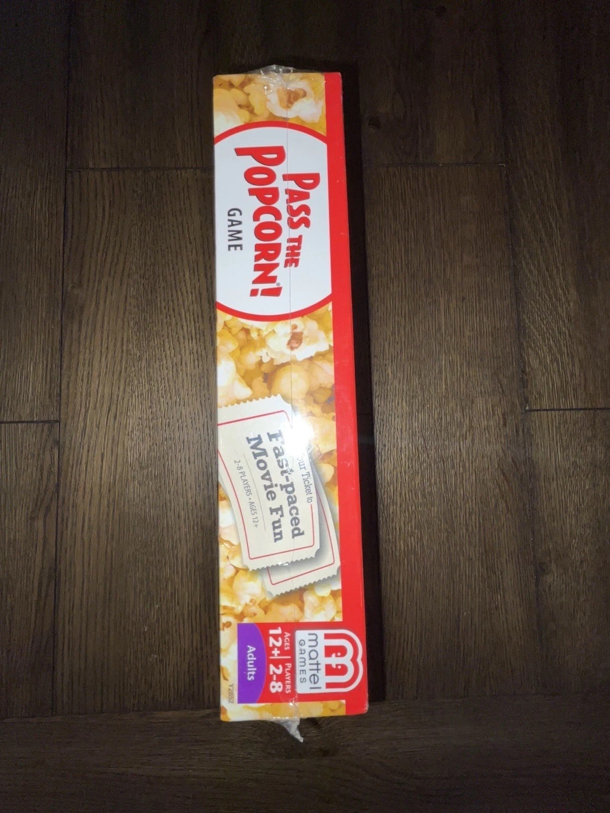 Mattel – Pass the Popcorn (Movie Trivia Family Party Game) – New / Sealed