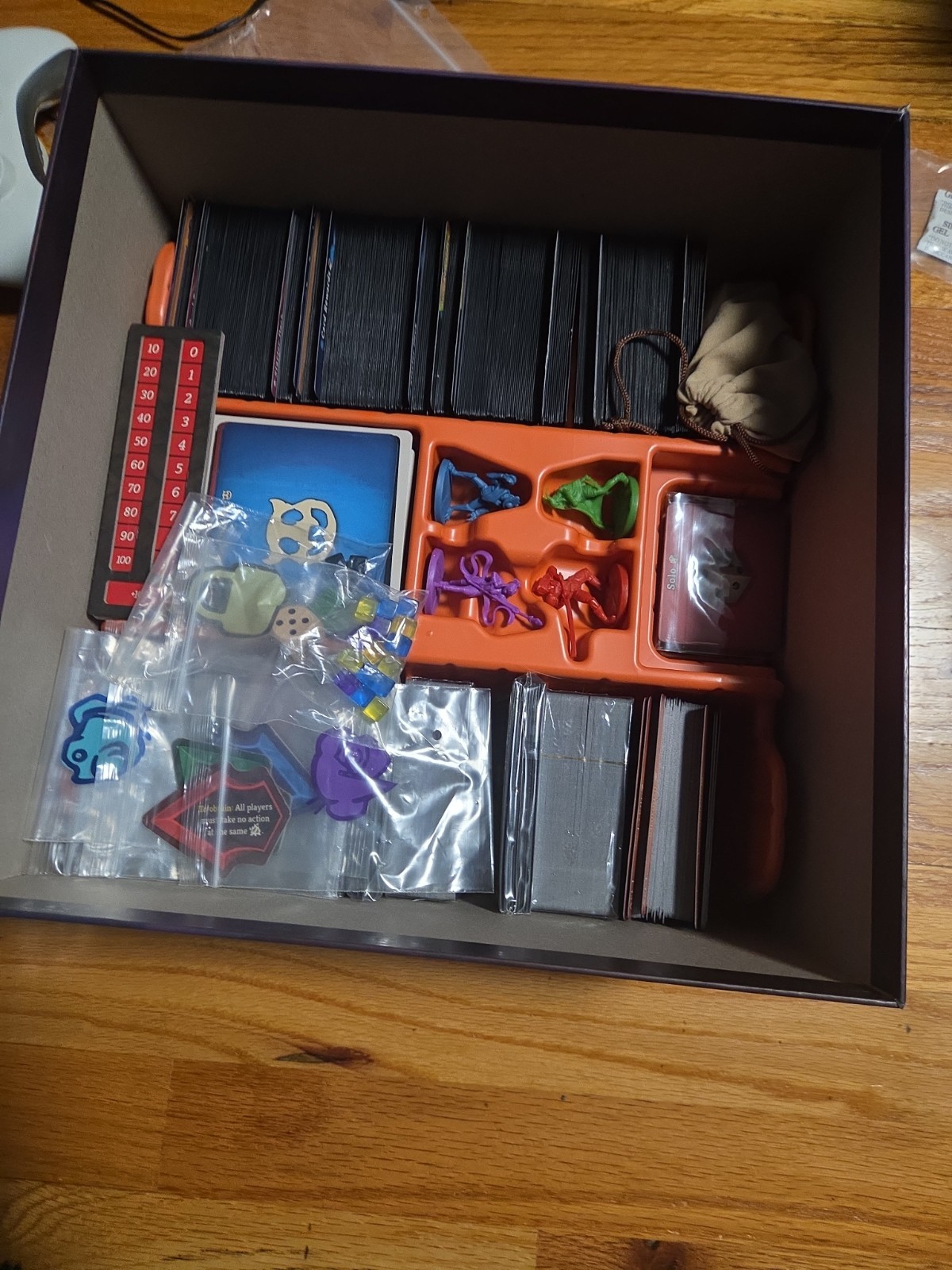 Slay the Spire The Board Game Collector’s Edition Open Box With Metal Coins