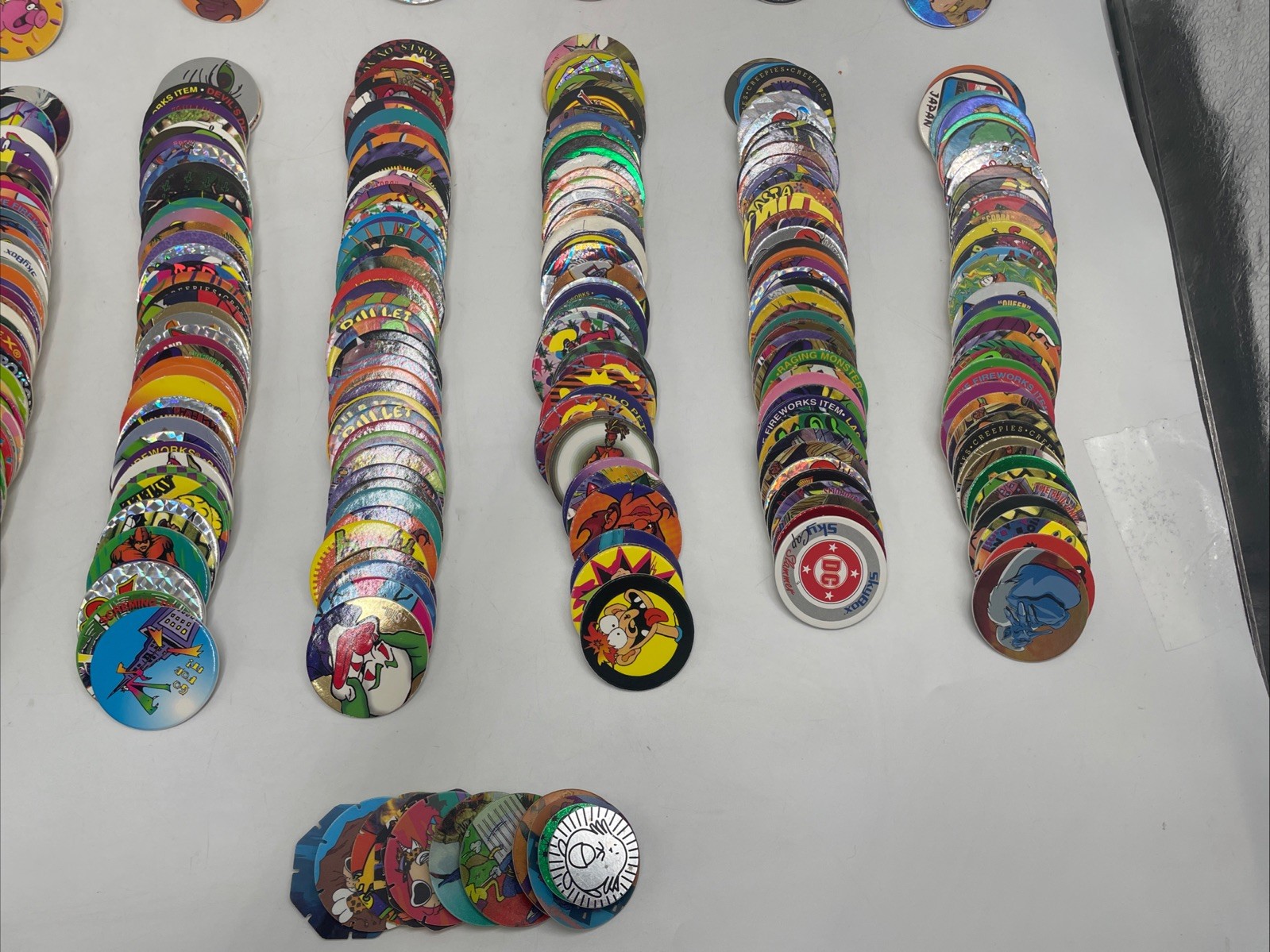 Large POGS Lot (825+ Milk Caps, 130+ Slammers, 10 Game Pads, 13 Tubes)