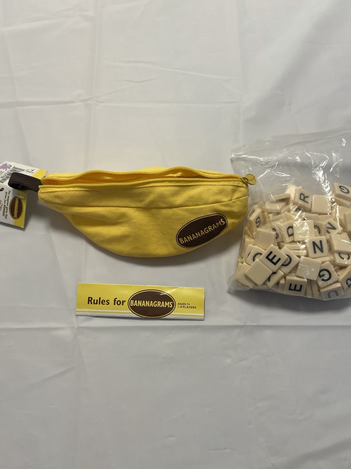 Bananagrams Family Fun Word Game NEW NWT – Portable Travel Pouch – 1-8 Players