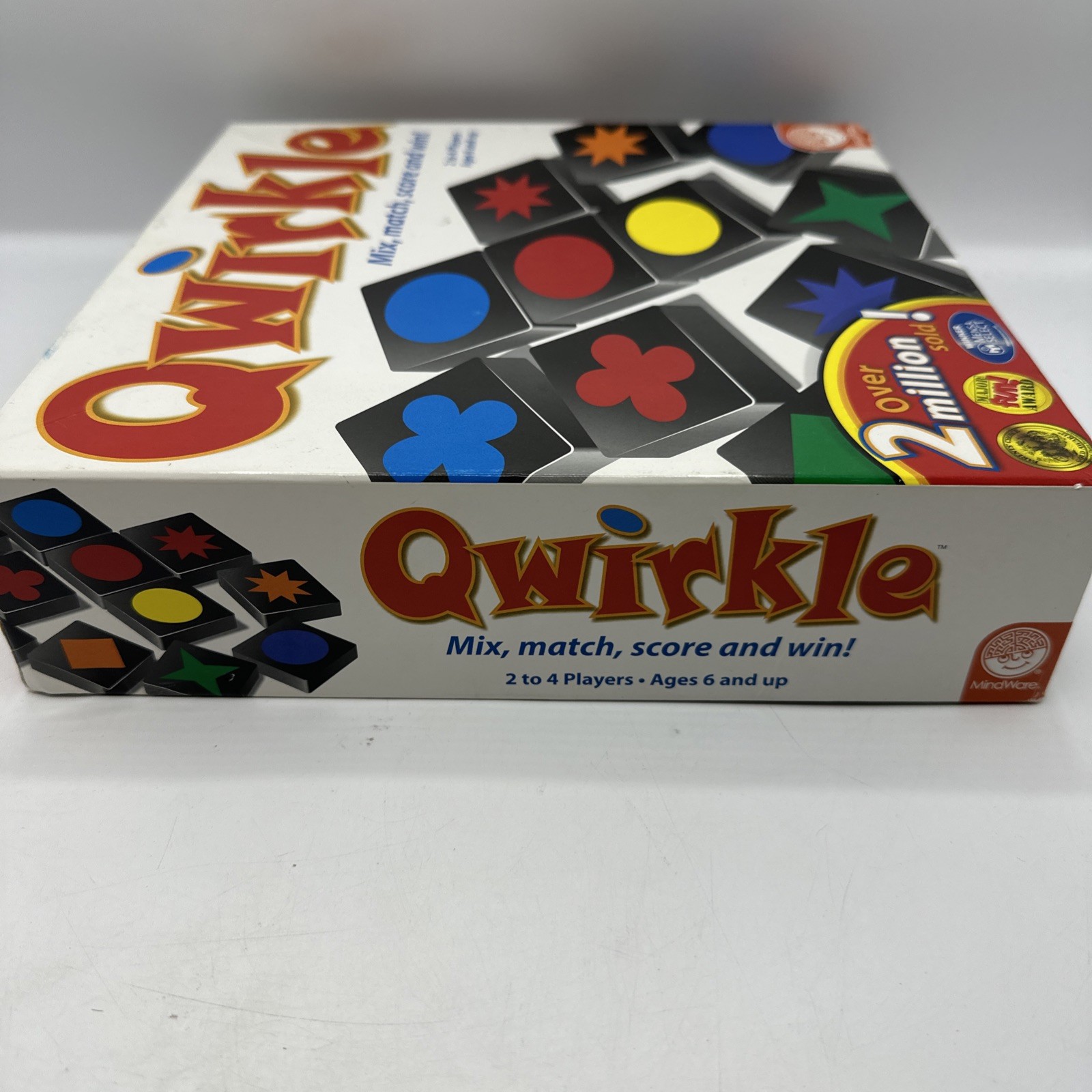 QWIRKLE – Mix, Match, Score and Wiin! 2-4 players, ages 6 and up. Complete 2010