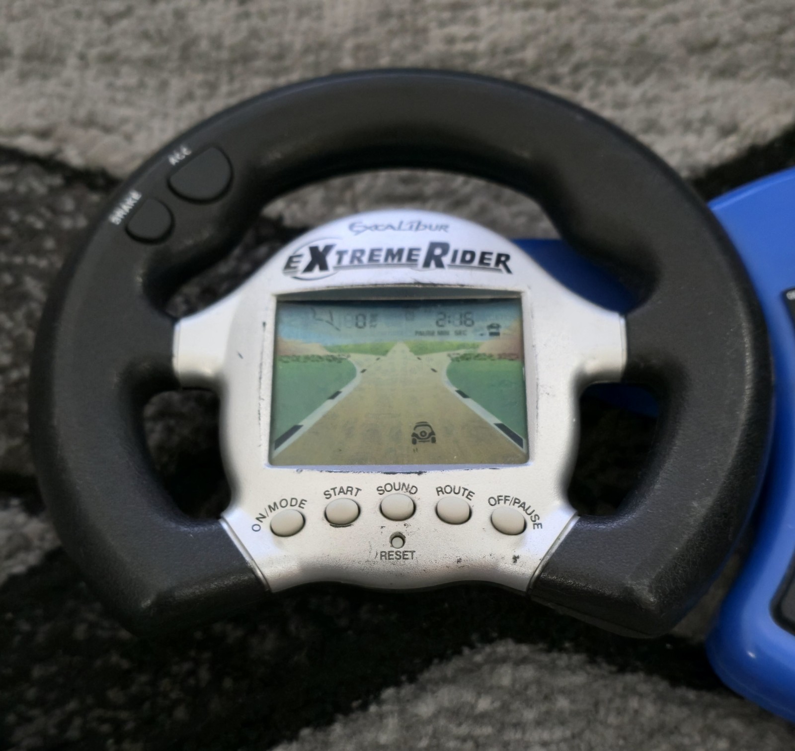 EXCALIBUR Extreme Rider Electronic Handheld Travel Game