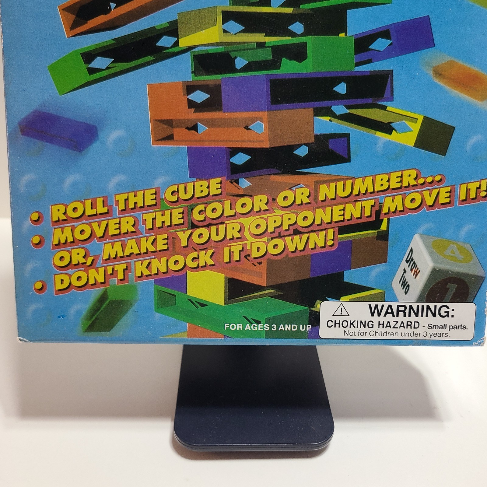 Stack Up Tower with 45 Colored Plastic Blocks and One Dice.