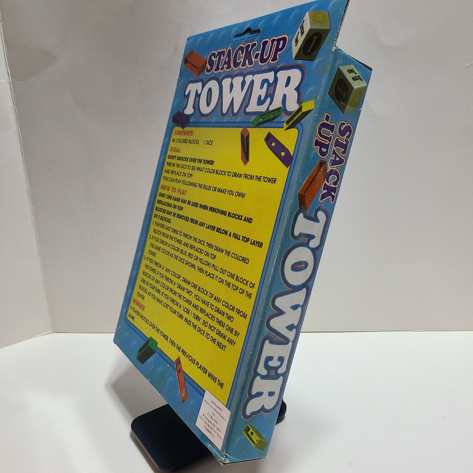 Stack Up Tower with 45 Colored Plastic Blocks and One Dice.