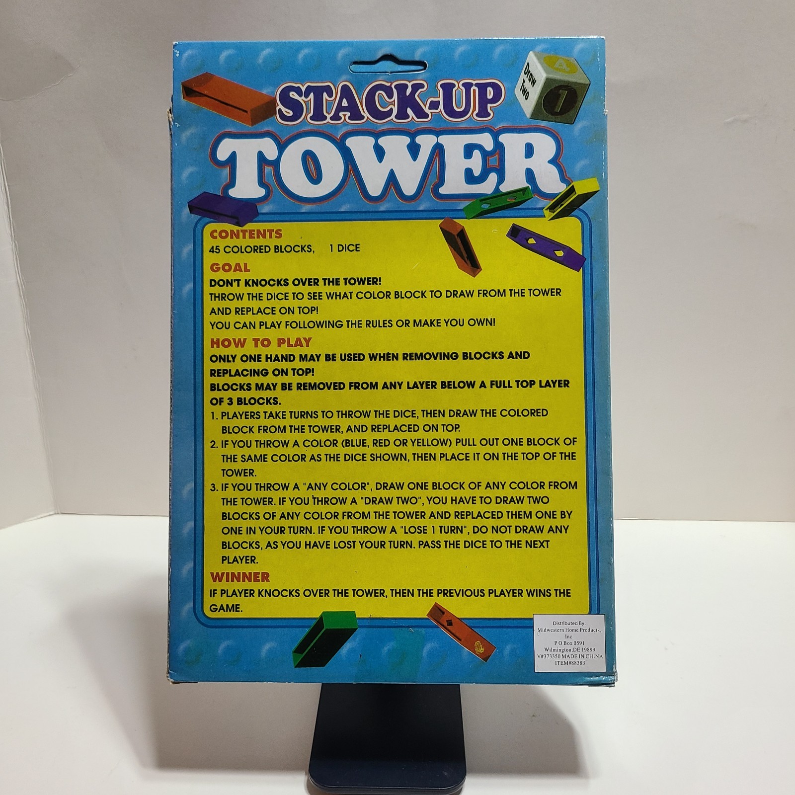 Stack Up Tower with 45 Colored Plastic Blocks and One Dice.