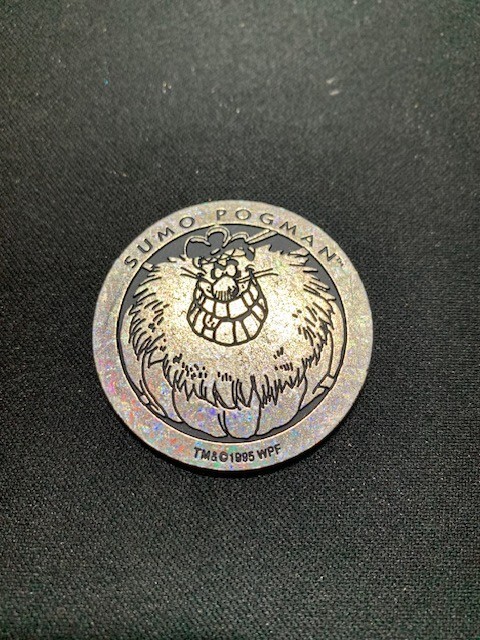 Metallic Silver colored vintage pog from The World Pog Federation 1995