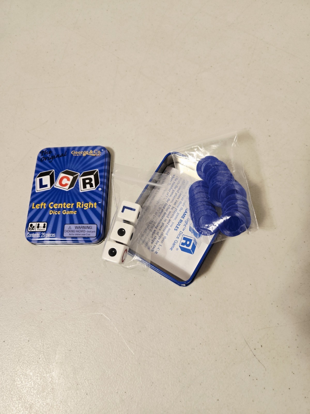 The Original LCR Left Center Right Dice Game Blue Tin (George & Co, 2010)