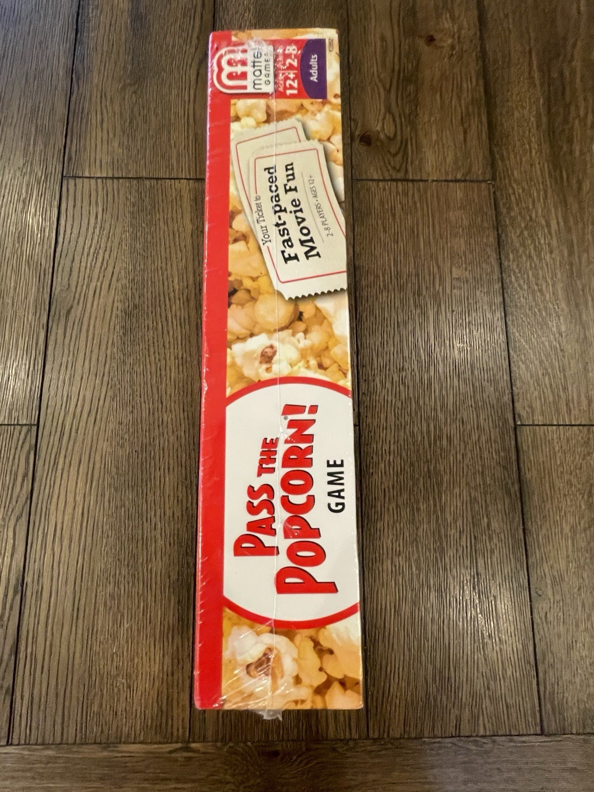 Mattel – Pass the Popcorn (Movie Trivia Family Party Game) – New / Sealed
