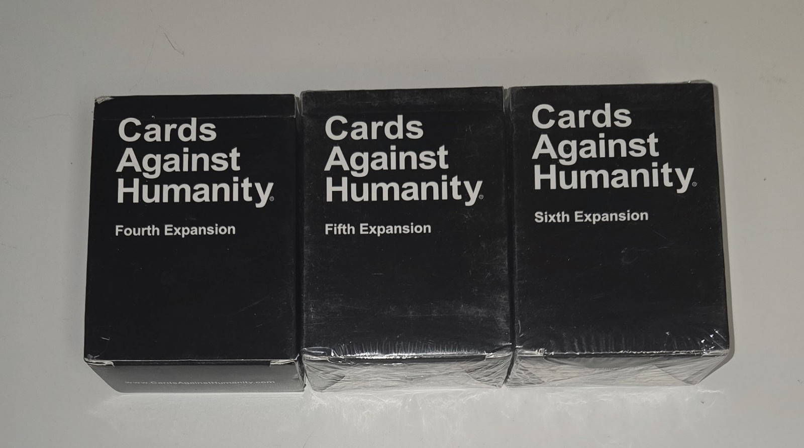 CARDS AGAINST HUMANITY Expansion Packs 4th (Open) 5th & 6th (Brand New & Sealed)