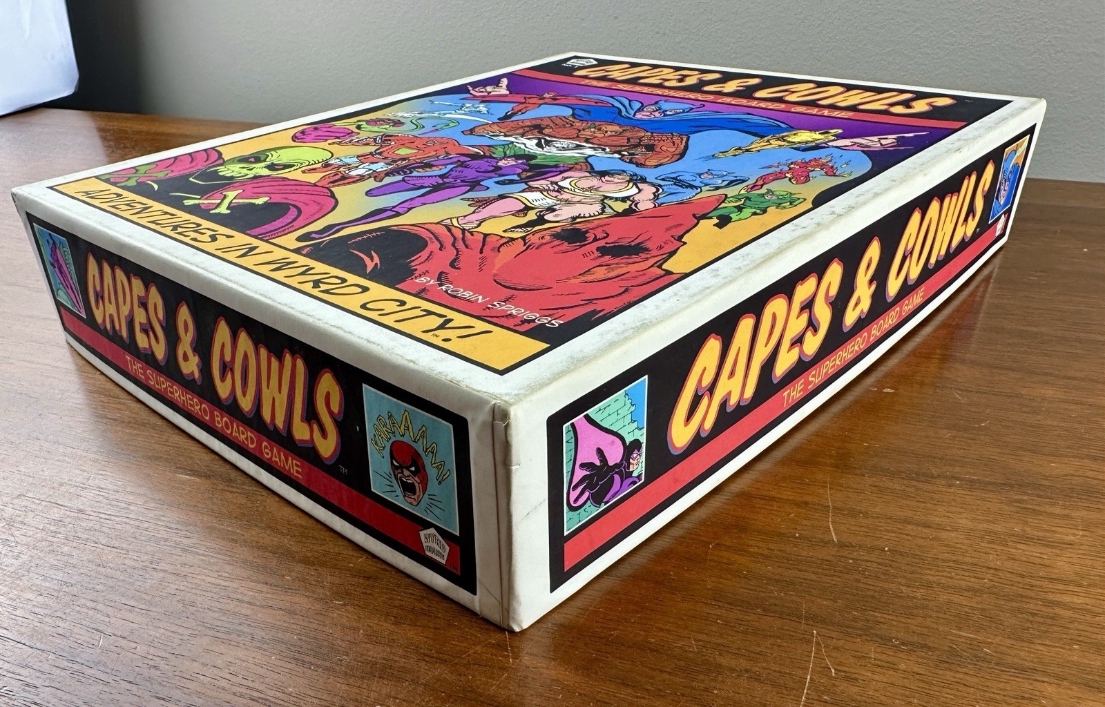Capes & Cowls: The Superhero Board Game Adventures in Wyrd City Ultra Super Rare