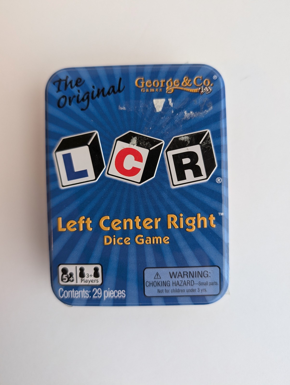 LCR® Left Center Right™ Dice Game – Blue Tin