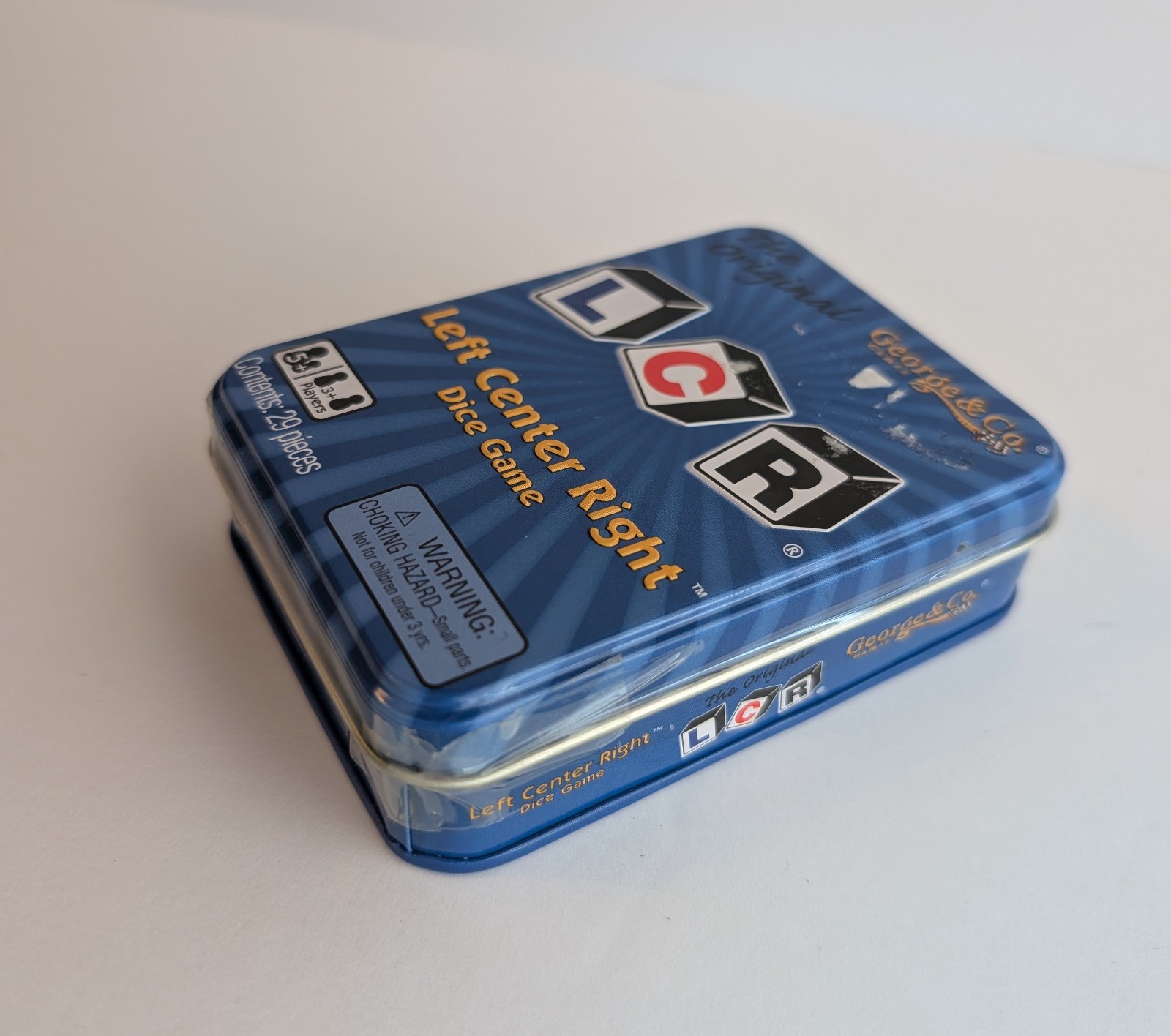 LCR® Left Center Right™ Dice Game – Blue Tin