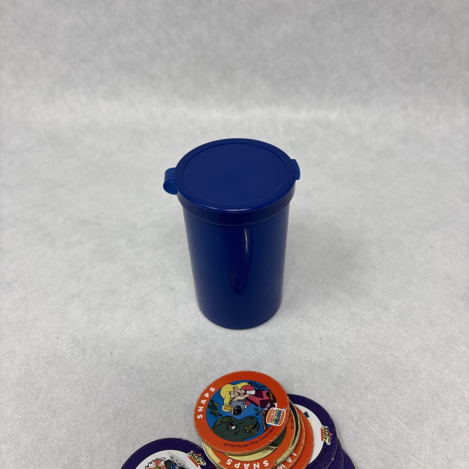 Vintage Pogs Lot Various 1990s Power Rangers, Jurassic Park, DC Comics w/ Tube
