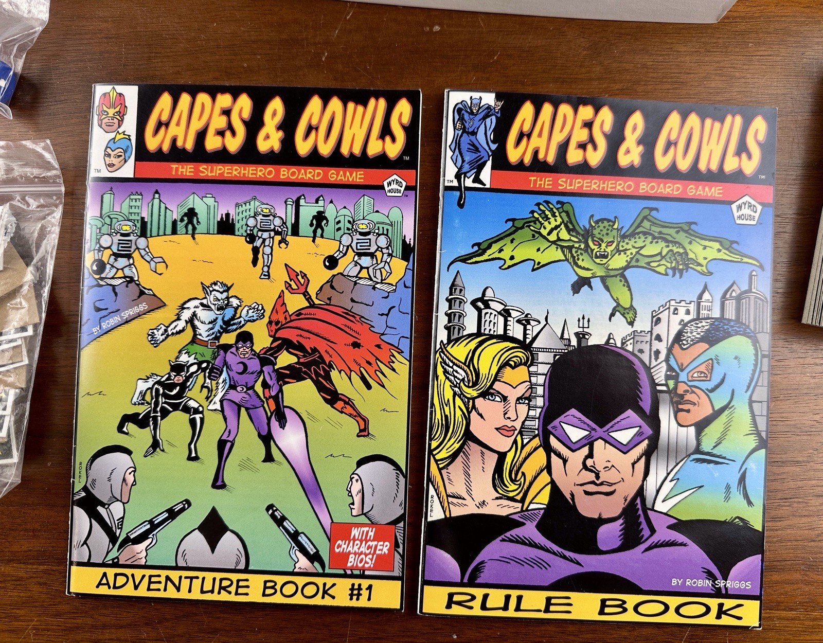 Capes & Cowls: The Superhero Board Game Adventures in Wyrd City Ultra Super Rare