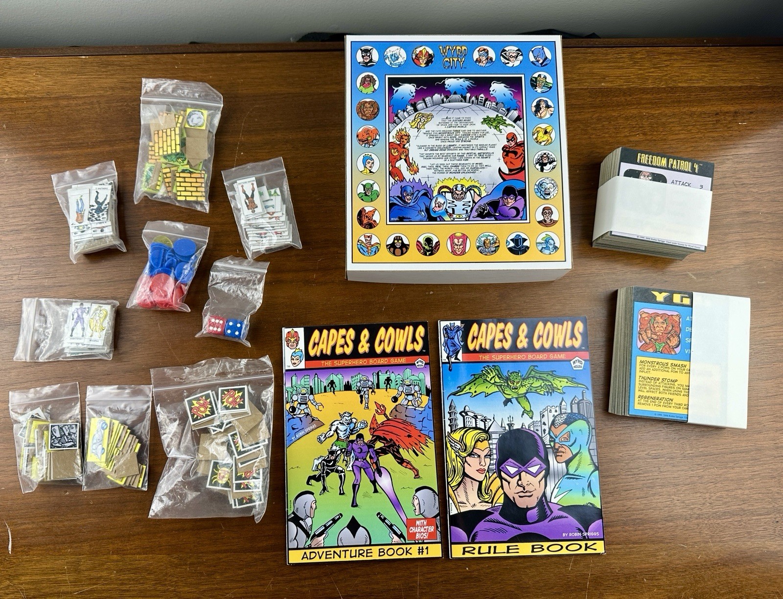 Capes & Cowls: The Superhero Board Game Adventures in Wyrd City Ultra Super Rare