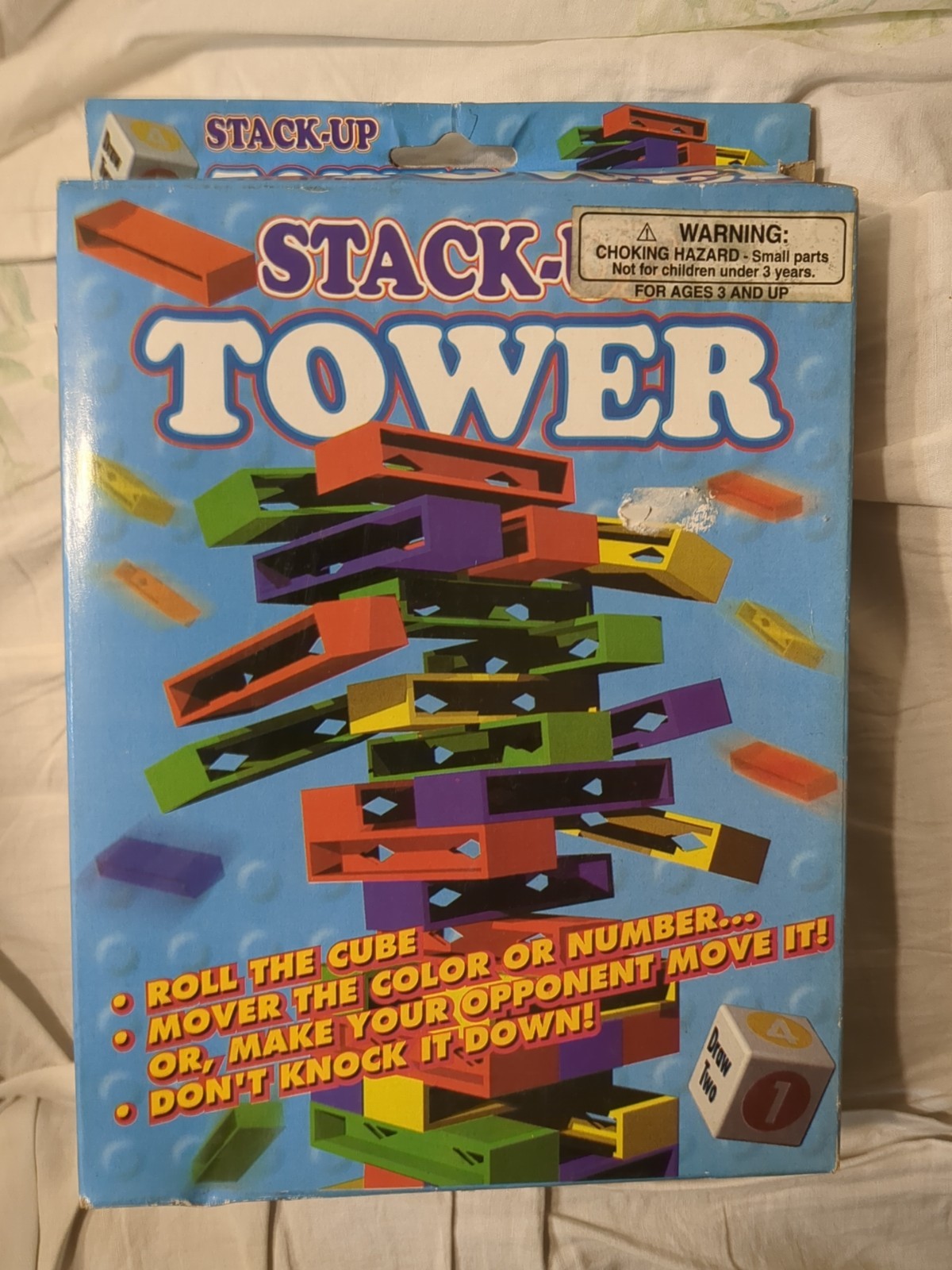 Stack Up Tower with 45 Colored Plastic Blocks and One Dice.